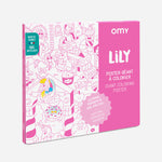 OMY Lily — child colouring on the poster spread out on the floor
