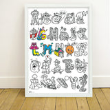 OMY ABC — child colouring on the poster and learning the alphabet