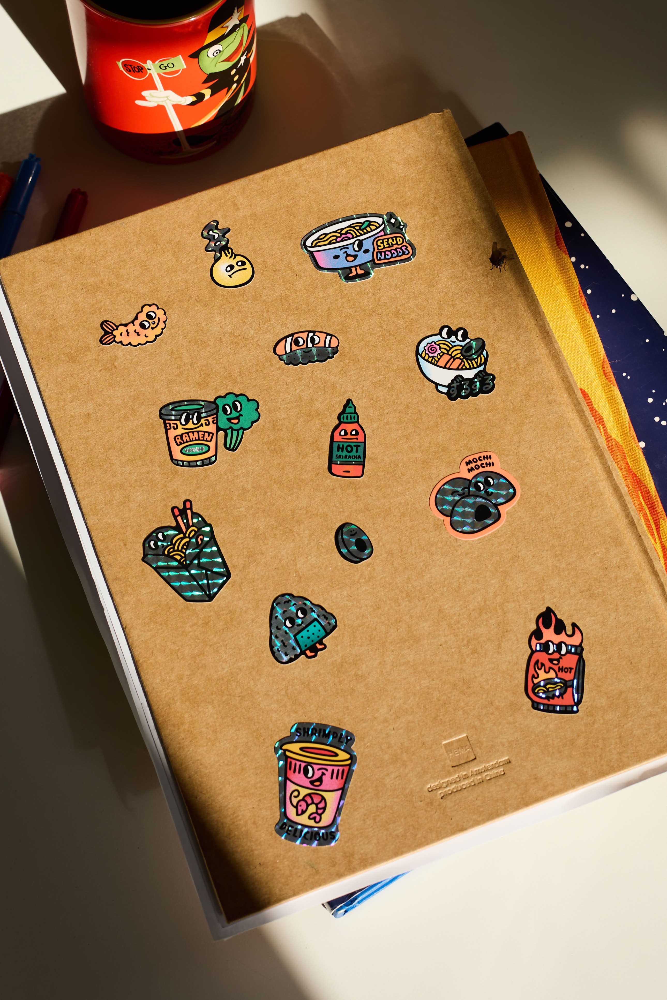 OMY Big Kitty - stickers applied on a notebook for personalisation