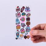 OMY Iconic Donuts — stickers applied on a notebook and water bottle