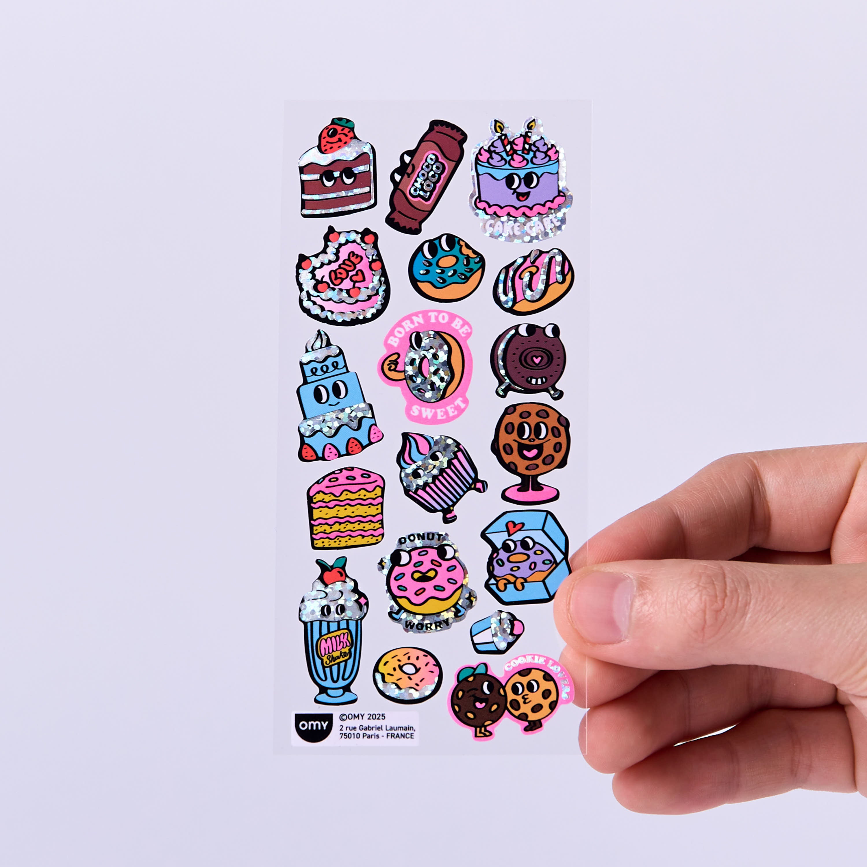 OMY Iconic Donuts — stickers applied on a notebook and water bottle