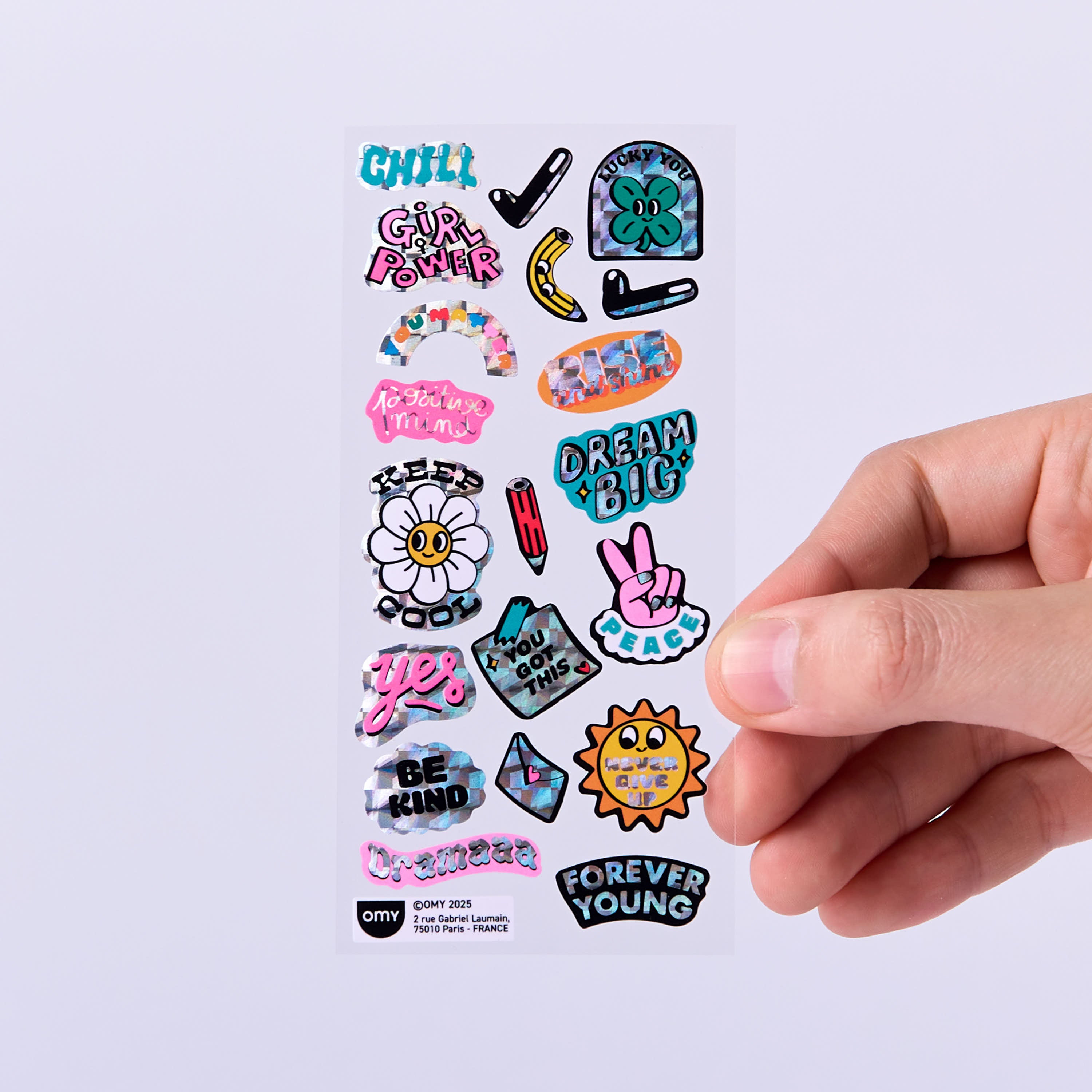 OMY Iconic Messages — stickers applied on a journal and notebook